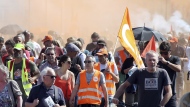Protesters march during a rally in Bayonne, southwestern France, Tuesday, June 6, 2023. French unions are seeking to reignite resistance to President Emmanuel Macron's higher retirement age with what may be a final surge of nationwide protests and scattered strikes Tuesday. (AP Photo/Bob Edme)