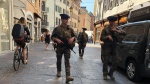 Soldiers patrol after a knife attack in Annecy, French Alps, Thursday, June 8, 2023. An attacker with a knife stabbed several young children and at least one adult, leaving some with life-threatening injuries, in a town in the Alps on Thursday before he was arrested, authorities said. (Florent Pecchio/L'Essor Savoyard via AP)
