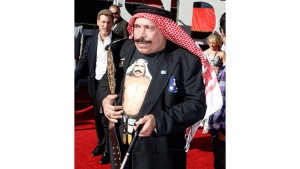 FILE - The Iron Sheik arrives at the ESPY Awards in Los Angeles on July 15, 2009. The Iron Sheik, born Hossein Khosrow Ali Vaziri, died Wednesday, June 7, 2023, at age 81. (AP Photo/Matt Sayles, File)