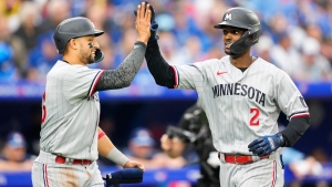 Minnesota Twins centre fielder Michael A. Taylor (2) celebrates his two-run home run with third baseman Royce Lewis (23) during the fifth inning of MLB American League baseball action in Toronto on Friday, June 9, 2023. THE CANADIAN PRESS/Mark Blinch 