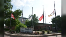 Flags outside Dauphin city hall fly at half mast
