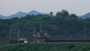 A North Korean military guard post, rear, and South Korea post, bottom, are seen in Paju near the border with North Korea, South Korea, Tuesday, July 18, 2023. An American has crossed the heavily fortified border from South Korea into North Korea, the American-led U.N. Command overseeing the area said Tuesday, amid heightened tensions over North Korea's nuclear program. (AP Photo/Ahn Young-joon)