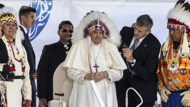 Pope Francis in traditional Indigenous headdress