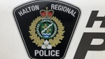 A Halton Regional Police logo is shown on a vehicle in Oakville, Ont., Wednesday, Jan.18, 2023. THE CANADIAN PRESS/Richard Buchan