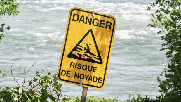 risk of drowning sign next to St. Lawrence River
