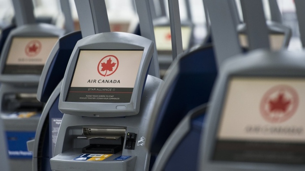 An Air Canada ticketing station is shown at Pearson International Airport in Toronto on Wednesday, April 8, 2020. Air Canada says earnings reached heights not seen since before the COVID-19 pandemic amid high travel demand and pricier fares, and despite low on-time performance numbers. THE CANADIAN PRESS/Nathan Denette
