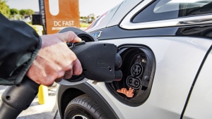 This photo provided by General Motors shows the combined charging system or CCS plug. It had been the dominant standard for EV charging until automakers decided to switch to Tesla's standard. (Jessica Lynn Walker/Courtesy of General Motors via AP)