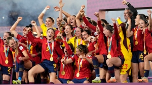 Spain players celebrate with the trophy at the end of the Women's World Cup soccer final between Spain and England at Stadium Australia in Sydney, Australia, Sunday, Aug. 20, 2023. Spain won 1-0. (AP Photo/Abbie Parr)