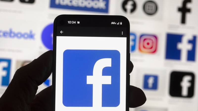 The Friends of Canadian Broadcasting group is asking people to stop posting content on Meta's platforms on Aug. 23 and 24. The Facebook logo is seen on a mobile phone, Oct. 14, 2022, in Boston. THE CANADIAN PRESS/AP-Michael Dwyer
