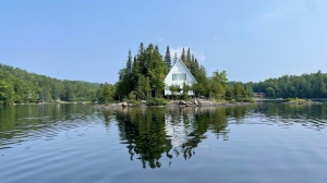 A Montreal-area company has come up with a novel — if extreme -- way to boost employee happiness: buying them a private island. A building is seen on an island in an undated handout photo. The Labelle, Que., getaway includes a single, two-bedroom cabin with enough room for eight people, as well as a barbecue, pedal boat, dinghy and other water sport equipment. THE CANADIAN PRESS/HO-Mon Technicien, *MANDATORY CREDIT*