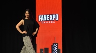 Actress Ming-Na Wen sachets onto the stage at Fan Expo Canada in Toronto Saturday August 26, 2023. 'I'm trying to entertain you!' she joked to the audience as she explained some of the restrictions around discussion topics because of the SAG-AFTRA strike.  (Joshua Freeman /CP24)