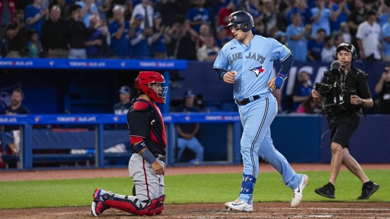 Toronto Blue Jays catcher Danny Jansen (9) crosses home plate after hitting a home run against the Washington Nationals during third inning MLB interleague baseball action in Toronto on Monday, August 28, 2023. THE CANADIAN PRESS/Andrew Lahodynskyj