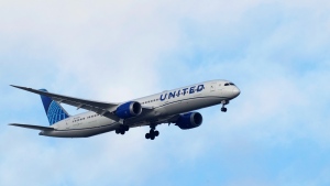 A United Airlines Boeing 787 approaches for landing in Lisbon, Saturday, Sept. 2, 2023. (AP Photo/Armando Franca)
