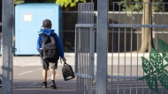 Students across much of Canada are packing lunches and slinging on backpacks today as they bid farewell to summer vacation and gear up for another school year. An elementary student arrives for his first day back to school in Montreal, Monday, Aug. 28, 2023. THE CANADIAN PRESS/Christinne Muschi