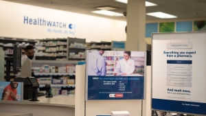 Signage explaining that Ontario pharmacists are able to provide prescriptions for minor health conditions appears at a Shoppers Drug Mart pharmacy in Etobicoke, Ont., on Wednesday, January 11, 2023. Ontario is planning to allow pharmacists to prescribe flu medication, administer flu shots to babies and administer RSV vaccines, when available, ahead of an expected fall viral surge. THE CANADIAN PRESS/ Tijana Martin