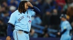 Toronto Blue Jays' Vladimir Guerrero Jr. (27) reacts after striking out against the Texas Rangers to end seventh inning American League MLB baseball action in Toronto on Thursday, September 14, 2023. THE CANADIAN PRESS/Nathan Denette