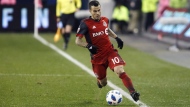 Major League Soccer's roster freeze came and went Friday without Toronto FC adding former league MVP Sebastian Giovinco back in the fold. Giovinco (10) keeps the ball in bounds as he runs up field during MLS soccer action against the Atlanta United in Toronto, Sunday, Oct. 28, 2018. THE CANADIAN PRESS/Cole Burston