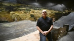Pierre Blouin sits inside the Cyclorama de Jerusalem, in Ste-Anne-de-Beaupré, Que., on Wednesday, Sept. 6, 2023. The last cyclorama in Canada has been hidden from public view since it shuttered in 2018, but a small group of people are hoping to revive the once popular attraction. THE CANADIAN PRESS/Jacques Boissinot