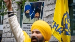 A picture of Hardeep Singh Nijjar is seen at a protest outside of the Consulate General of India Office during following the recent shooting in Vancouver, on Saturday, June 24, 2023. THE CANADIAN PRESS/Ethan Cairns