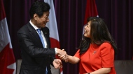 A new battery supply chain agreement between Canada and Japan comes as Canada wants to expand its position in the battery industry and Japan wants to secure access to lucrative American EV subsidies for its automakers. Japan's Minister of Economy, Trade and Industry Nishimura Yasutoshi, left, shakes hands with Canada's Minister of Export Promotion, International Trade and Economic Development Mary Ng, during a signing ceremony in Ottawa, on Thursday, Sept. 21, 2023. THE CANADIAN PRESS/Justin Tang