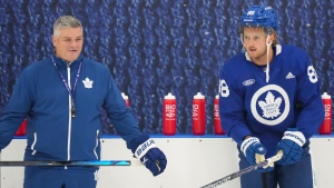 Toronto Maple Leafs forward William Nylander, right, yells next to Maple Leafs head coach Sheldon Keefe at practice during the opening week of their NHL training camp in Toronto, Thursday, Sept. 21, 2023. THE CANADIAN PRESS/Nathan Denette