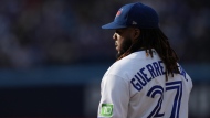 Toronto Blue Jays first baseman Vladimir Guerrero Jr. stands on first base during eighth inning American League MLB baseball action against Boston Red Sox in Toronto, Saturday, Sept. 16, 2023. Guerrero Jr. returned to the starting lineup Friday for Toronto's series opener against the Tampa Bay Rays.THE CANADIAN PRESS/Chris Young