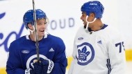 Toronto Maple Leafs teammates Max Domi, left, and Ryan Reaves laugh at practices during the opening week of their NHL training camp in Toronto, Thursday, Sept. 21, 2023. THE CANADIAN PRESS/Nathan Denette