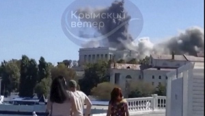This UGC image shows the moment a missile hits the headquarters of the Russian Black Fleet, in Sevastopol, Friday, Sept. 22, 2023. (Crimean Telegram channel via AP)