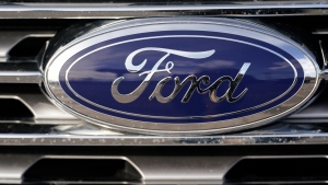 FILE - In this April 25, 2021 file photograph, the blue oval logo of Ford Motor Company is shown in east Denver. (AP Photo/David Zalubowski, File) 