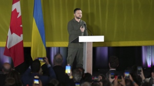 FILE - Ukrainian President Volodymyr Zelenskyy listens to an impromptu rendition of the Ukrainian national anthem at an event including members of the Ukrainian-Canadian community, in Toronto, on Friday, Sept. 22, 2023. Ukrainian President Volodymyr Zelenskyy was traveling home from North America, where he addressed the U.N. General Assembly and paid his first wartime visit to Canada.(Chris Young/The Canadian Press via AP)