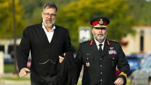 Lt.-Gen. Steven Whelan, right, and his lawyer Phillip Millar arrive at a court martial in Gatineau, Que., on Monday, Sept. 25, 2023. THE CANADIAN PRESS/Sean Kilpatrick