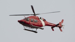 Quebec provincial police say three people are dead after a fishing boat sunk off the province's Lower North Shore. A Coast Guard helicopter flies over the port of St. John’s on Saturday, June 24, 2023. THE CANADIAN PRESS/Adrian Wyld