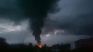 This grab taken from video distributed by Siranush Sargsyan's Twitter account on Monday, Sept. 25, 2023, shows smoke rising after a fuel depot explosion near Stepanakert, Nagorno-Karabakh. Several dozen people were injured on Monday night at a gas station just outside of the breakaway region's capital, Stepanakert, where a fuel tank exploded. Dozens of people were lining up at the gas station at the time to fuel their cars in order to move to Armenia. (Siranush Sargsyan's Twitter account via AP)
