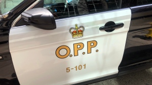 An Ontario Provincial Police vehicle sits idle in downtown Toronto, Tuesday, April 11, 2023. THE CANADIAN PRESS/Tammy Hoy 