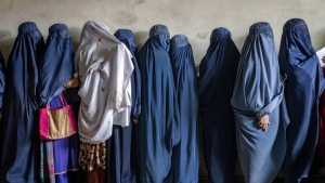 Afghan women wait to receive food rations distributed by a humanitarian aid group, in Kabul, Afghanistan, Tuesday, May 23, 2023. (AP Photo/Ebrahim Noroozi, File)
Ebrahim Noroozi