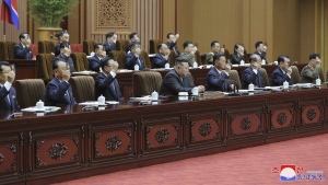 In this photo taken during a two-day session on Sept. 26-27, 2023 and provided by the North Korean government, North Korean leader Kim Jong Un, bottom center, attends a meeting of the country's parliament in Pyongyang, North Korea. Independent journalists were not given access to cover the event depicted in this image distributed by the North Korean government. The content of this image is as provided and cannot be independently verified. Korean language watermark on image as provided by source reads: "KCNA" which is the abbreviation for Korean Central News Agency. (Korean Central News Agency/Korea News Service via AP)