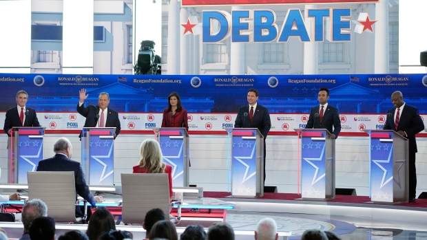 Republican presidential candidates, from left, North Dakota Gov. Doug Burgum, former New Jersey Gov. Chris Christie, former U.N. Ambassador Nikki Haley, Florida Gov. Ron DeSantis, entrepreneur Vivek Ramaswamy, and Sen. Tim Scott, R-S.C., stand at their podiums during a Republican presidential primary debate hosted by FOX Business Network and Univision, Wednesday, Sept. 27, 2023, at the Ronald Reagan Presidential Library in Simi Valley, Calif. (AP Photo/Mark J. Terrill) 