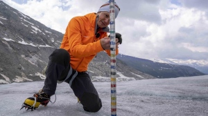 ETH (Swiss Federal Institute of Technology) glaciologist and head of the Swiss measurement network Glamos, Matthias Huss, checks the thickness of the Rhone Glacier near Goms, Switzerland, June 16, 2023. (AP Photo/Matthias Schrader, File)
Matthias Schrader