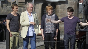 Members of the cast of the Harry Potter films, from left, Tom Felton, Michael Gambon, Rupert Grint, and Daniel Radcliffe during grand opening ceremonies of the Wizarding World of Harry Potter at Universal Orlando theme park in Orlando, Florida, Friday, June 18, 2010. Actor Michael Gambon, who played Dumbledore in the later Harry Potter films, has died at age 82, his publicist says. (AP Photo/John Raoux, File)