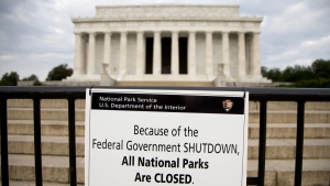 A sign reading "Because of the Federal Government SHUTDOWN All National Parks are Closed" is posted on a barricade in front of the Lincoln Memorial in Washington, Oct. 1, 2013. The federal government is heading toward a shutdown that will disrupt many services, squeeze workers and roil politics. (AP Photo/Carolyn Kaster, File)