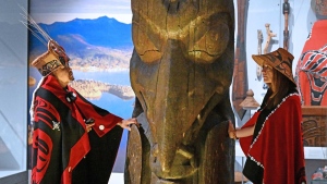 Amy Parent, right, is shown in a handout photo with the Ni'isjoohl memorial pole alongside Nisga'a Chief Earl Stephens during a visit to the National Museum of Scotland. A homecoming celebration will be held for the memorial totem pole after an absence of almost 100 years on Friday. THE CANADIAN PRESS/HO-National Museums Scotland-Neil Hanna 