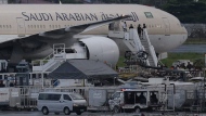 A Saudi Arabian Airlines plane Flight SV872 from Jeddah is shown at an isolated area at Manila's International Airport in Pasay, south of Manila, Philippines on Tuesday, Sept. 20, 2016. Saudia, formerly known as Saudi Arabian Airlines, is resuming flights to Toronto in December, after five years of no direct connections with Canada since a 2018 spat over the Liberals' loud condemnation of the kingdom's human-rights record. THE CANADIAN PRESS/AP-Aaron Favila