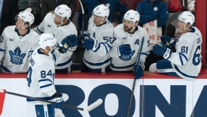 Toronto Maple Leafs' Mikko Kokkonen (84) is congratulated on his goal by teammates during second period NHL preseason hockey action against the Montreal Canadiens, in Montreal on Friday, Sept. 29, 2023. THE CANADIAN PRESS/Christinne Muschi