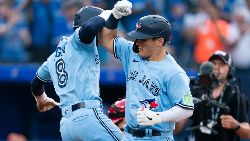Toronto Blue Jays' Daulton Varsho (25), right, celebrates his two-run home run against the Philadelphia Phillies with Cavan Biggio (8) during second inning interleague MLB baseball action in Toronto on Wednesday, August 16, 2023. THE CANADIAN PRESS/Spencer Colby