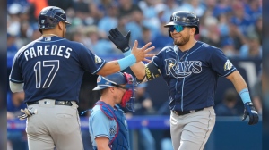 Tampa Bay Rays second baseman Jonathan Aranda (62) celebrates his grand slam with teammate Isaac Paredes during second inning American League MLB baseball action against the Toronto Blue Jays in Toronto, Sunday, Oct. 1 2023. THE CANADIAN PRESS/Frank Gunn