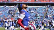 Buffalo Bills safety Damar Hamlin removes his helmet while warming up prior to an NFL football game against the Miami Dolphins, Sunday, Oct. 1, 2023, in Orchard Park, N.Y. (AP Photo/Jeffrey T. Barnes)