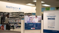 Signage explaining that Ontario pharmacists are able to provide prescriptions for minor health conditions is photographed at a Shoppers Drug Mart pharmacy in Etobicoke, Ont., on January 11, 2023. THE CANADIAN PRESS/ Tijana Martin
