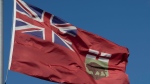 Manitobans are to make history today as they cast final ballots in an election that has followed four weeks of promises, debates and controversial advertisements. The flag of Manitoba flies in Ottawa, Monday, Nov. 1, 2021. THE CANADIAN PRESS/Adrian Wyld
