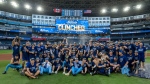 The Toronto Blue Jays celebrate clinching an American League Wild Card series berth, in Toronto, Sunday, Oct. 1, 2023. THE CANADIAN PRESS/Frank Gunn