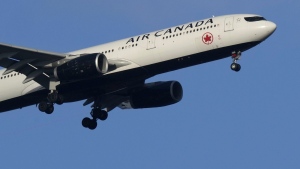 An Air Canada Airbus A330 approaches for landing in Lisbon, Saturday, Sept. 2, 2023. THE CANADIAN PRESS/AP-Armando Franca